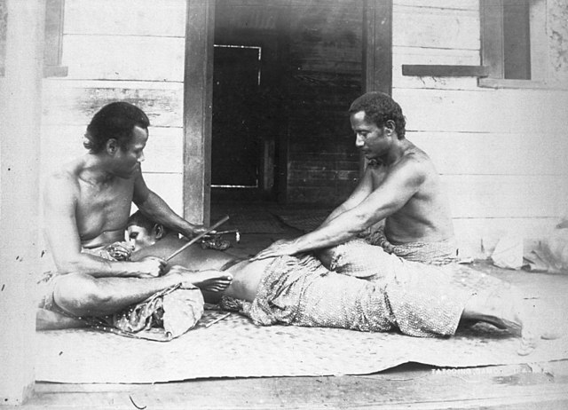 black and white photo of a traditional samoan tatau
