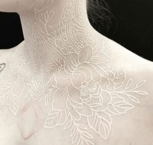 white ink neck tattoo